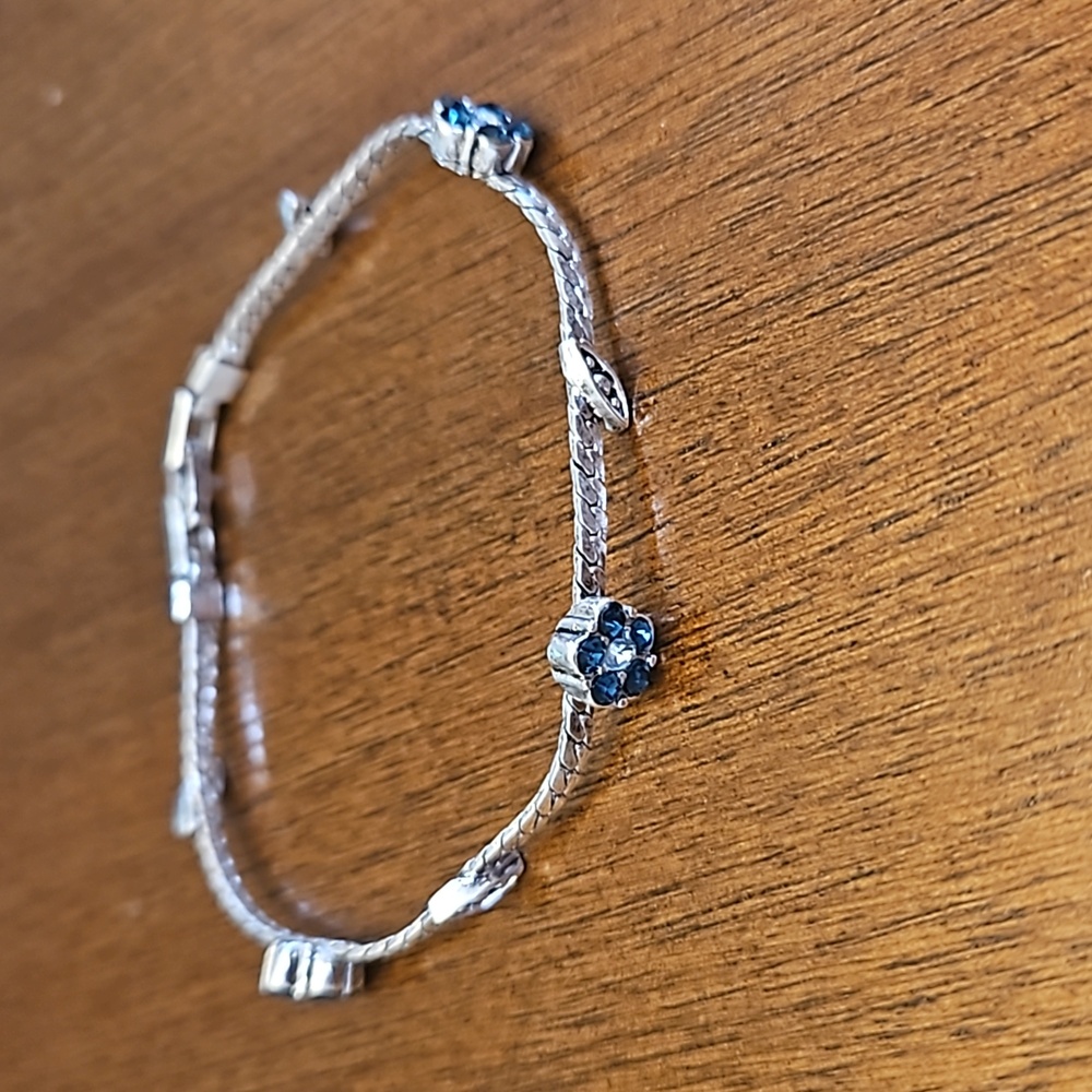 Three silver-toned bracelets - at least one is sterling silver - Picture 4 of 5